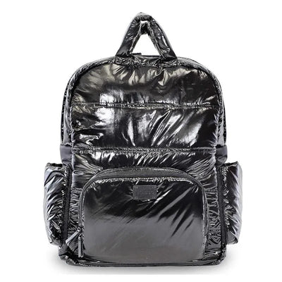 Diaper bag backpack in black polar, featuring a glossy finish, multiple pockets, and a convenient top handle.