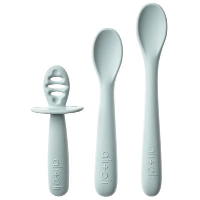 Three light blue baby spoons from Ali + Oli, including a short grip spoon and two varying sizes for different feeding stages.