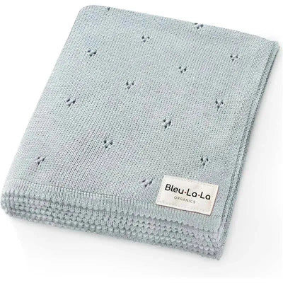 100% organic cotton pointelle swaddle receiving blanket in powder blue, featuring a textured design and a label.