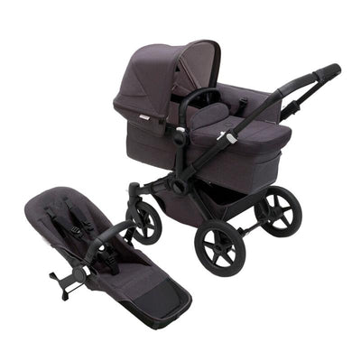 Bugaboo Donkey 5 Mineral Mono Complete stroller in Black/Washed Black, featuring a seat and removable carrycot.