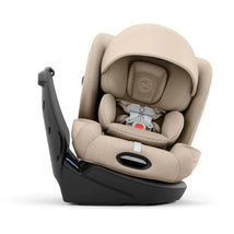 Cybex Callisto T 360 convertible car seat in Cozy Beige, featuring a padded seat, adjustable canopy, and safety harness.