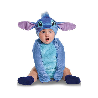 Stitch infant costume in blue with large ears and a matching hat, worn by a baby sitting with an excited expression.
