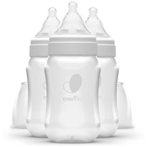 Three Evenflo Feeding 9 oz wide bottles with clear design and soft nipples, featuring the Evenflo logo.