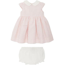 Cotton jacquard baby dress in pink with cap sleeves and a white collar, paired with matching white diaper cover.