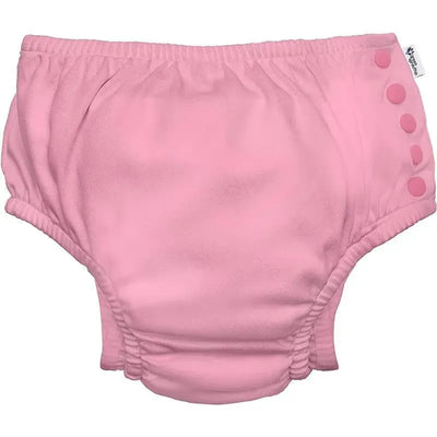 Light pink reusable swim diaper with gathered sides and snap buttons for easy wearing. Ideal for eco-friendly swimming.