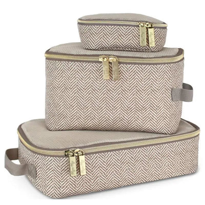 Three taupe packing cubes in varying sizes feature a herringbone pattern and gold zippers. Ideal for organized travel.