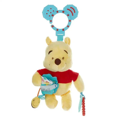 Winnie the Pooh plush activity toy holding a honey pot, features a colorful ring and textured elements.