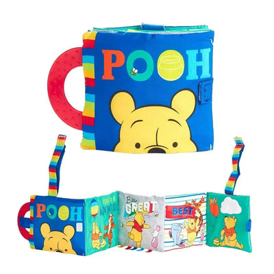 Soft cloth book featuring Winnie the Pooh, colorful pages with illustrations, and a graspable handle.