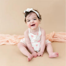 Kyte Baby Spaghetti Strap Ruffle Romper In Bow Image 1