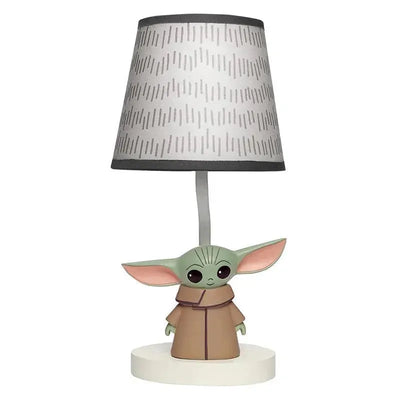 Lamp in the shape of Baby Yoda, featuring a gray patterned shade and a round white base.