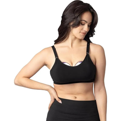 Lansinoh Braverly Pumping Bra in black, worn by a woman, featuring adjustable straps and a comfortable fit for breastfeeding.