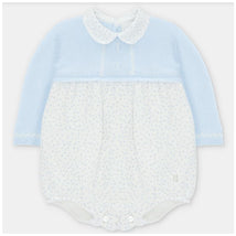 Pastel blue romper with a knitted top and polka dot woven bottom; features a collar and front buttons.