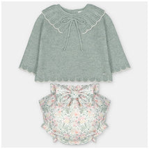 Sweater and bloomer set in green knit with floral-patterned fabric, featuring a scalloped neckline and decorative bow.
