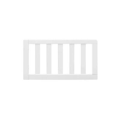 Toddler bed conversion kit in white, featuring a slatted design for safety and style. Perfect for transitioning to a toddler bed.