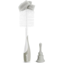 Bristle bottle brush with gray and white design, featuring a foam top and a smaller cleaning brush attachment.