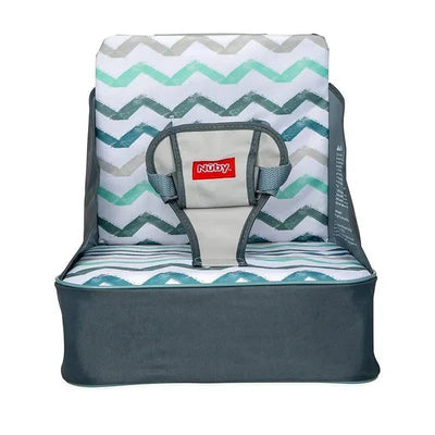 Collapsible booster seat by Nuby with a chevron pattern, featuring safety straps for infants.