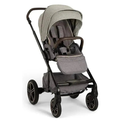 Nuna MIXX™ next stroller in Monterey color features a magnetic buckle, adjustable canopy, and spacious storage.