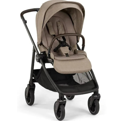 Nuna SWIV™ Stroller in Acorn color, featuring a reclining seat, adjustable canopy, and a storage basket underneath.
