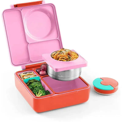 Insulated pink bento box open, featuring various compartments filled with pasta, broccoli, grapes, and a leak-proof thermos jar.
