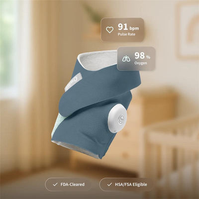 Owlet Dream Sock in Bedtime Blue displaying pulse rate of 91 bpm and oxygen level of 98%, with FDA-cleared label.