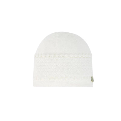 Cream knit newborn hat with decorative texture and a small logo tag, designed for infants.
