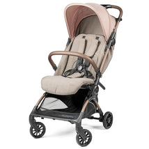 Volo Ultra Lightweight Carry On Compliant Travel Stroller by Peg Perego in beige and pink, featuring a harness and storage basket.