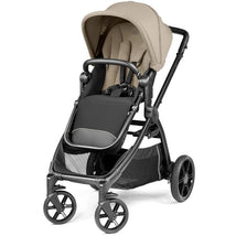 Compact Peg Perego Ypsi stroller in Vanilla Blend with a black and cream design, featuring a canopy and adjustable seat.