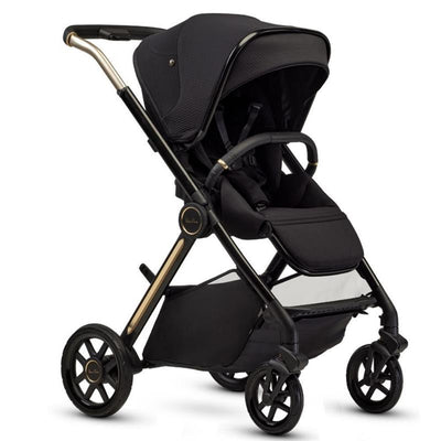 Multi-terrain modular stroller in Espresso Special Edition, featuring a sleek black design with gold accents and a spacious storage basket.