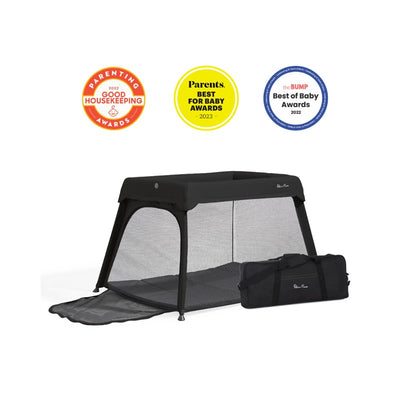 Silver Cross Sleep & Go 3-in-1 travel crib, bassinet, and playard in black with a carrying bag, featuring mesh sides and a foldable design.