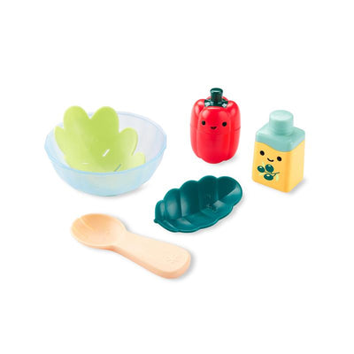 Skip Hop Baby Bath Toy Salad Set featuring a transparent bowl, two leaf-shaped plates, a red bell pepper, and a playful yellow bottle.