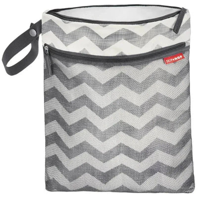 Skip Hop Grab & Go Wet/Dry Bag in white and grey chevron pattern, featuring a zippered compartment and carry strap.
