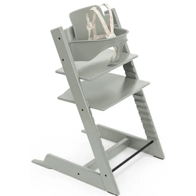 Stokke Tripp Trapp high chair in Glacier Green with a safety harness and adjustable seat and footrest.