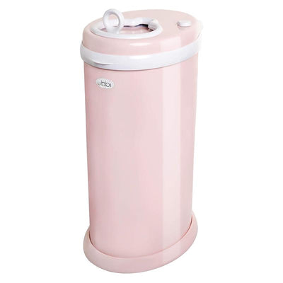 Ubbi steel diaper pail in blush pink, designed to lock in odors without needing special bags.