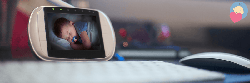 Baby monitor displaying sleeping infant with pacifier, ideal for parents monitoring newborns at home.