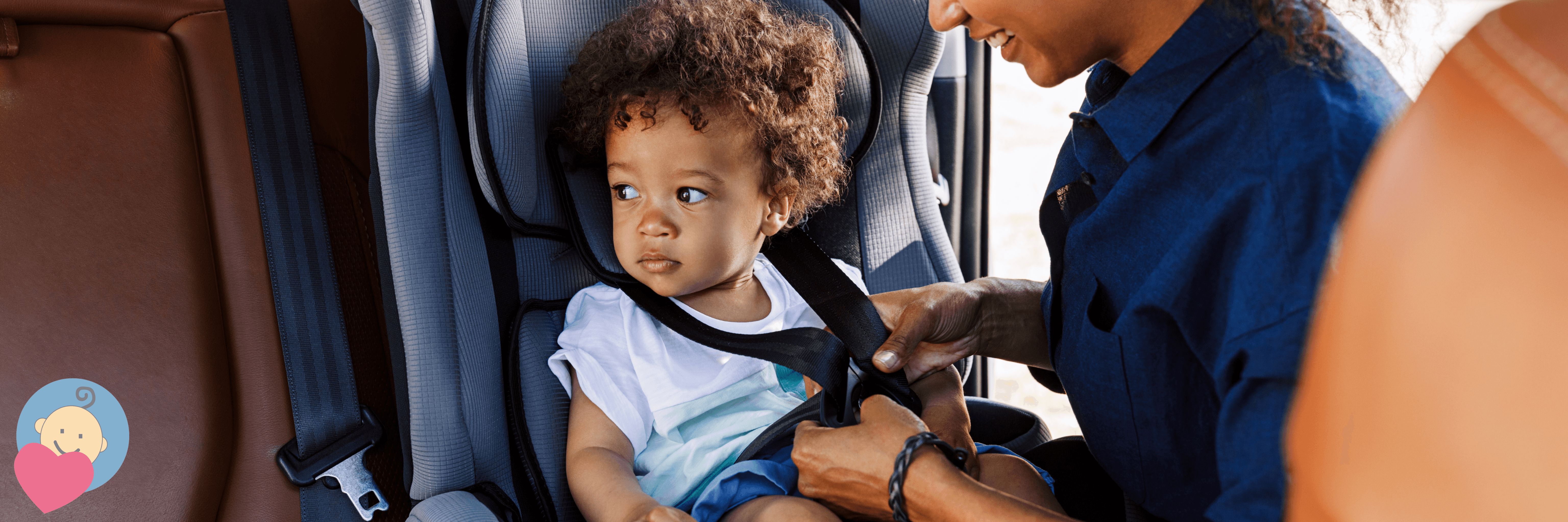 Mom securing toddler in car seat, baby safety essentials for travel