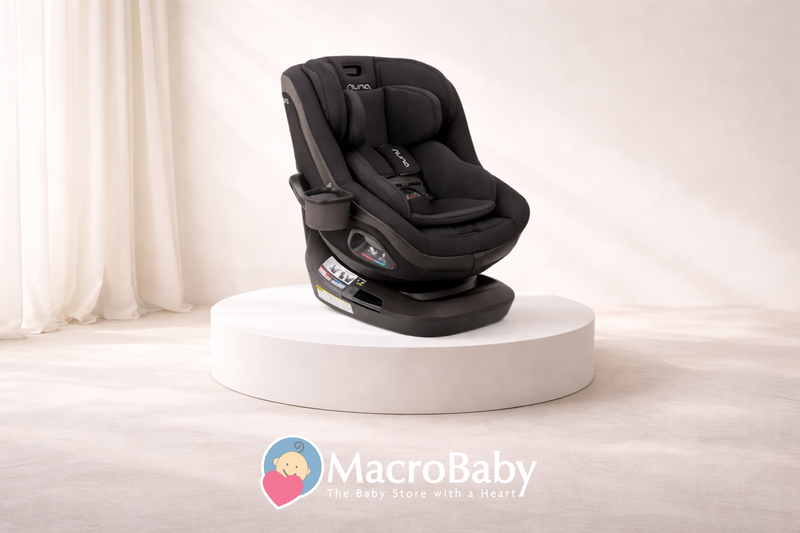 Nuna convertible car seat for babies and toddlers, shown on white display pedestal in bright room
