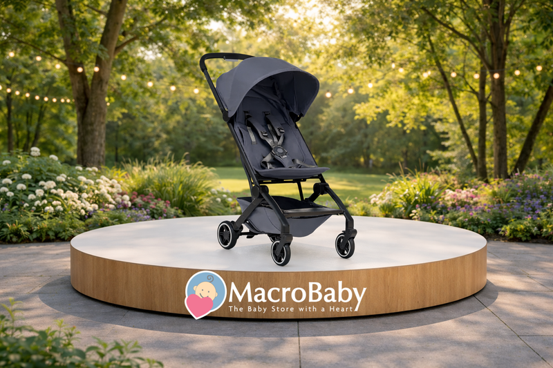 Stylish gray baby stroller on display in a garden setting, perfect for outdoor walks with your little one.