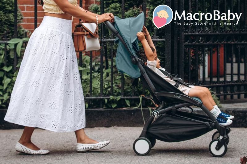 Mom pushing baby in YOYO stroller outdoors, perfect for urban walks and baby gear essentials