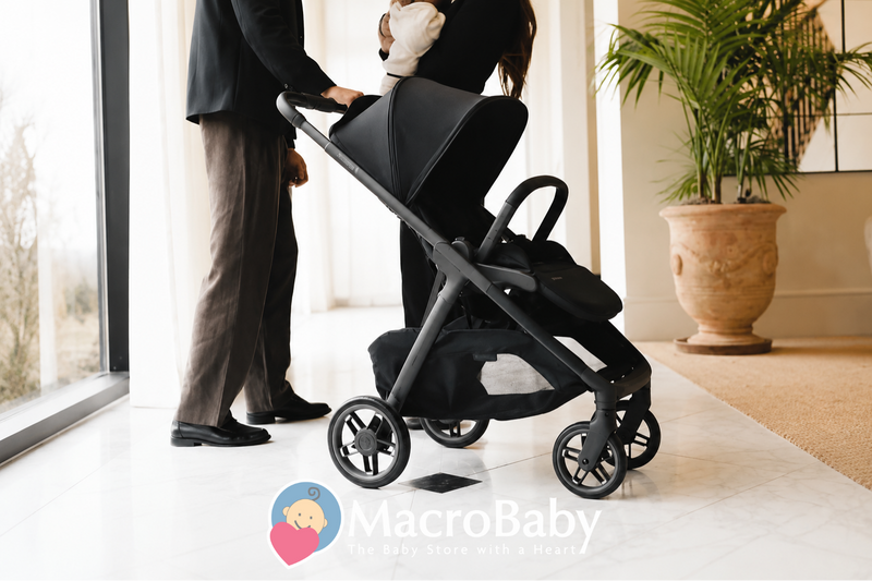 Modern black baby stroller with parents indoors, sleek design for easy mobility and comfort