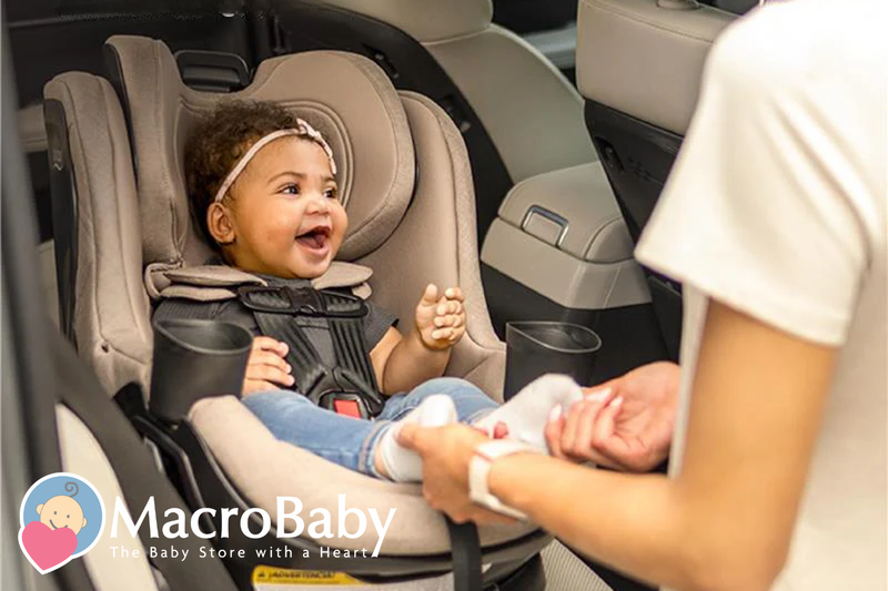 Happy baby in car seat with parent adjusting straps, safe infant travel gear