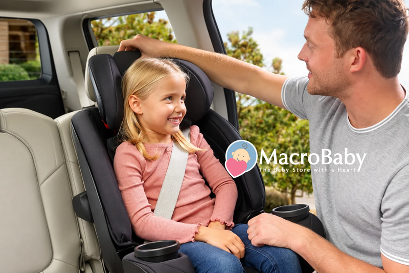 Father adjusting a car seat for his smiling daughter.