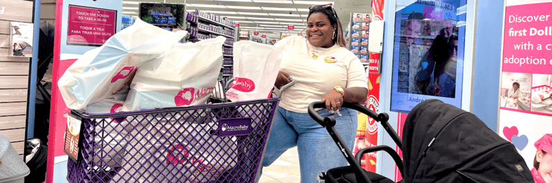 Woman shopping with stroller and MacroBaby bags in store