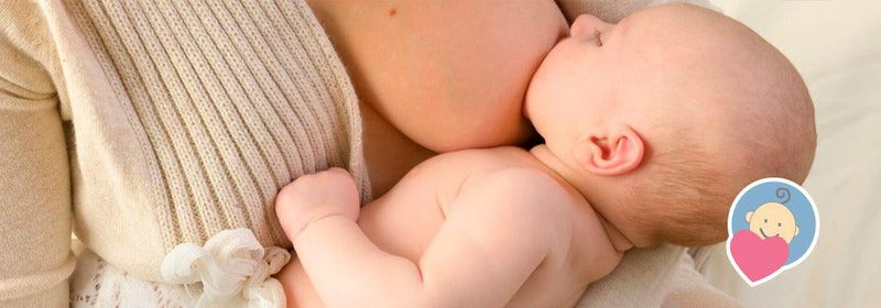 Mother breastfeeding newborn baby, cozy knit sweater, gentle parenting moment