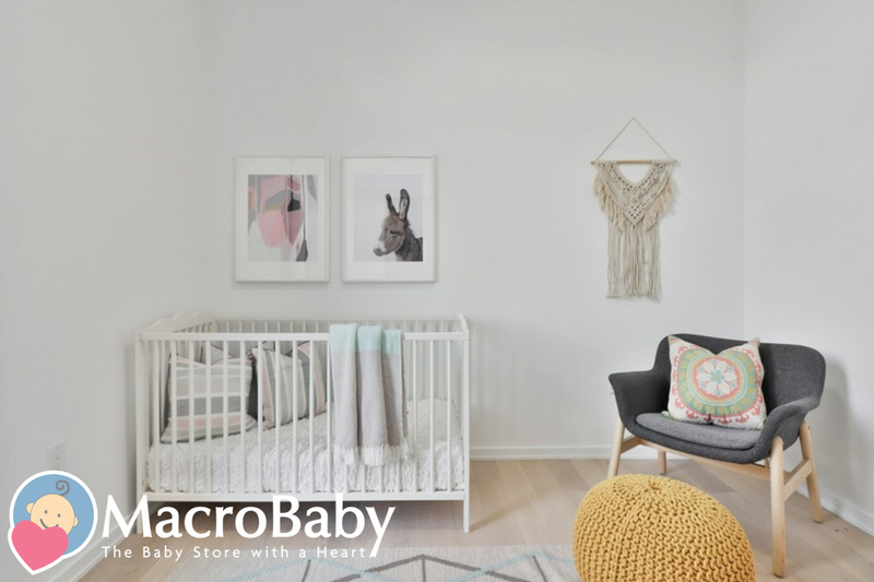 Cozy nursery with white crib, armchair, and macrame wall hanging - MacroBaby safe sleep 2026 blog banner