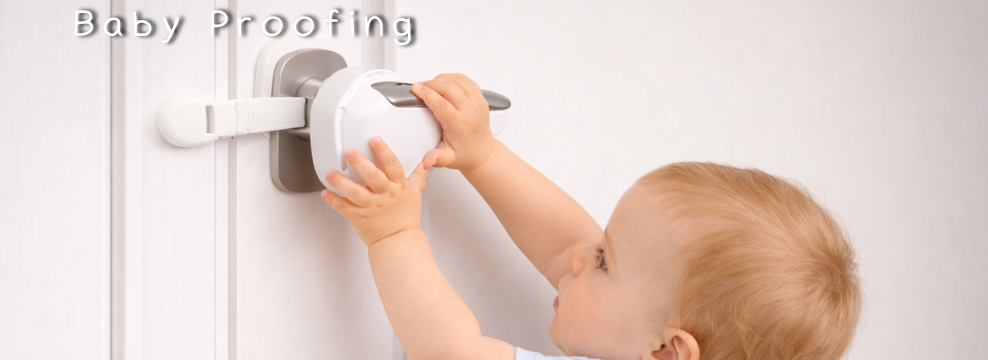Baby using white door handle lock for baby proofing safety