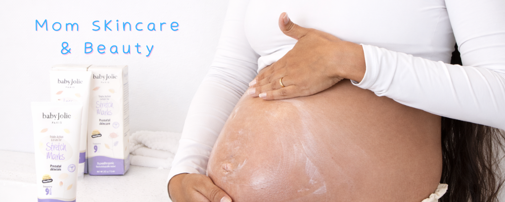 Pregnant woman applying Baby Jolie stretch mark cream, mom skincare & beauty products
