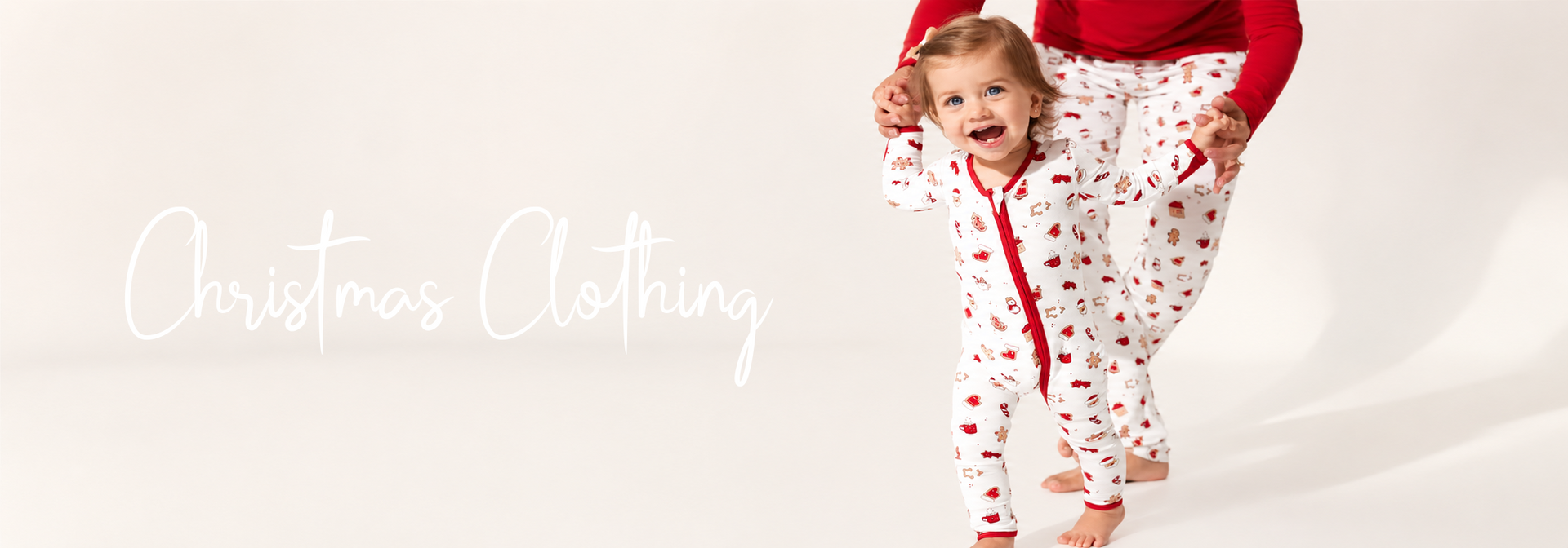 Baby in festive Christmas pajamas with gingerbread print, matching parent set, holiday family clothing
