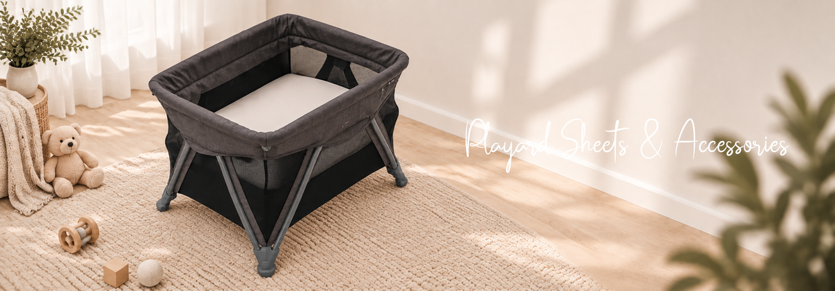 Playard with fitted sheet and baby accessories in a bright, modern nursery
