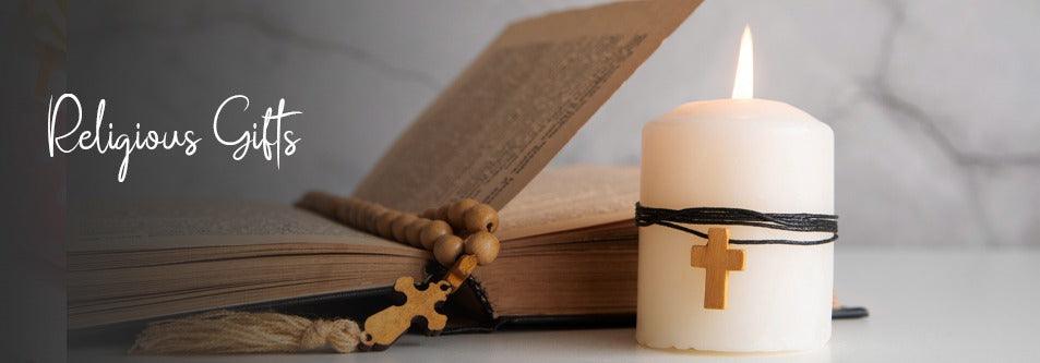 Religious gifts: wooden rosary, holy book, and cross candle for spiritual occasions