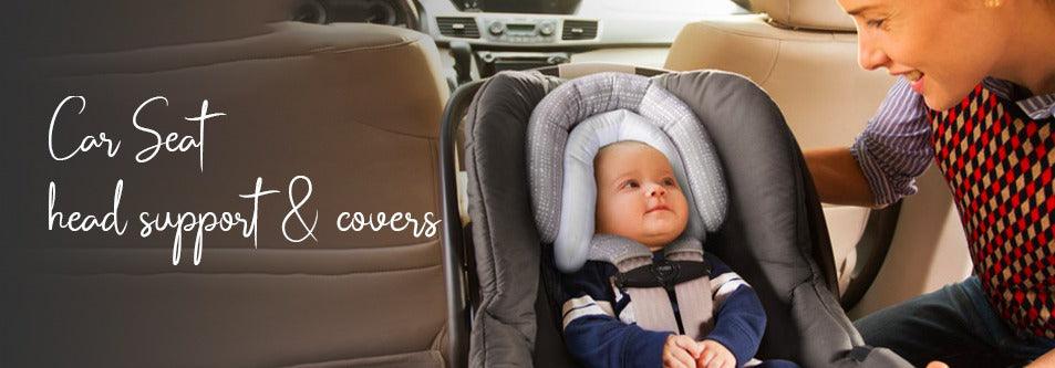 Baby in car seat with head support, mom smiling nearby